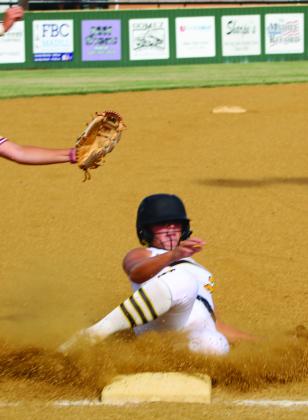 Dahlia Marris slides into home plate during the Madill vs Byng game. Kimber Gentis