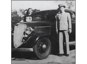 RD Taliaferro and his family standing by the Ford Coupe that Clyde stole. Courtesy photo