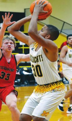 Madill senior Mason Coles lines up for a a shot during the Madill v. Tishomingo game on January 12, 2021. Summer Bryant • The Madill Record