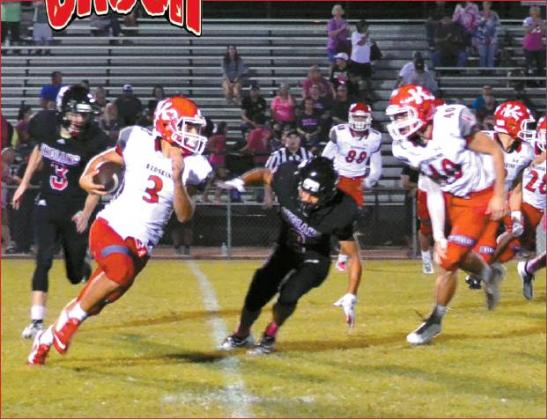 Lori Robinson • The Madill Record Junior Jarron ‘Boomer’ Morgan #3, runs circles around the Tishomingo Indians players, as Freshman Karson Daniel #40 comes with assistance.