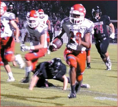 Lori Robinson • The Madill Record Freshman Devin Tipton #28, runs in from 23 yards to put another score on the board for the Redskins.