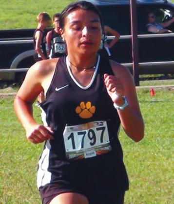 Esmerelda Flores runs hard for Madill at the Cat Run on September 5. The high school girls took thrid place. Courtesty photo