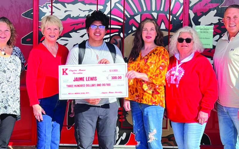 The Kingston High School Alumni Association officers and members presented a check to student-athlete Jaime Lewis to help fund his trip to the Native American All-Star Game. Courtesy photo